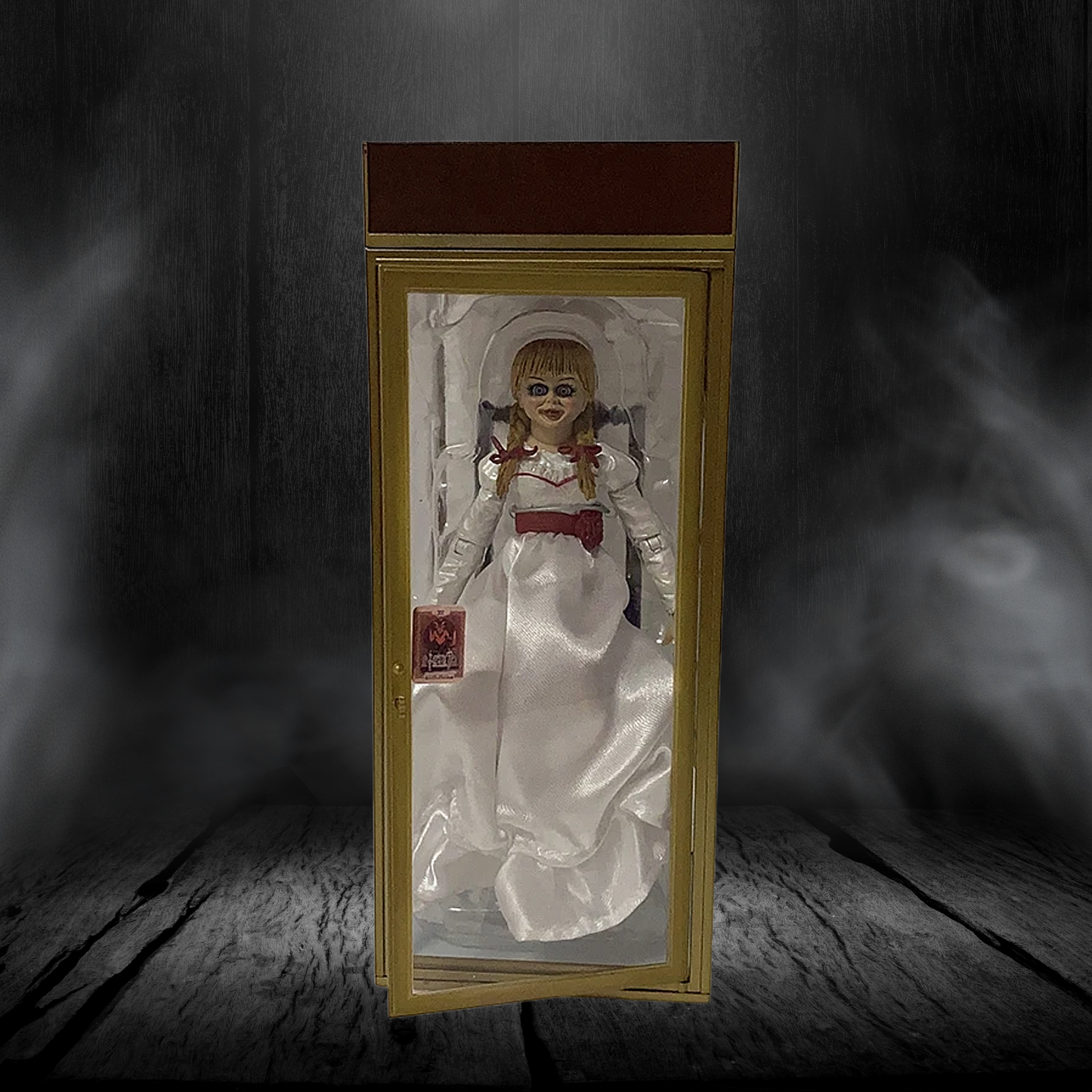 Horror-themed doll in a glass case with a dark, eerie background