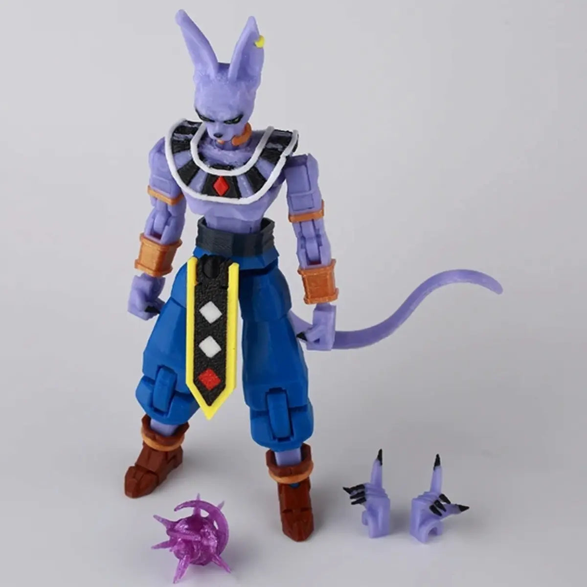 Action figure with a purple and blue outfit on a white background