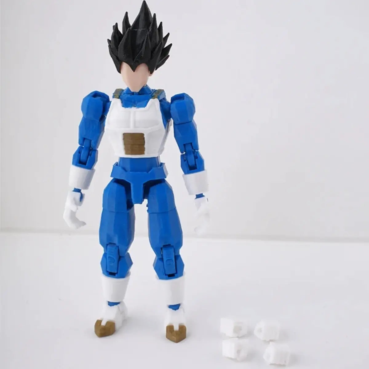 Action figure in blue and white costume on a light gray background