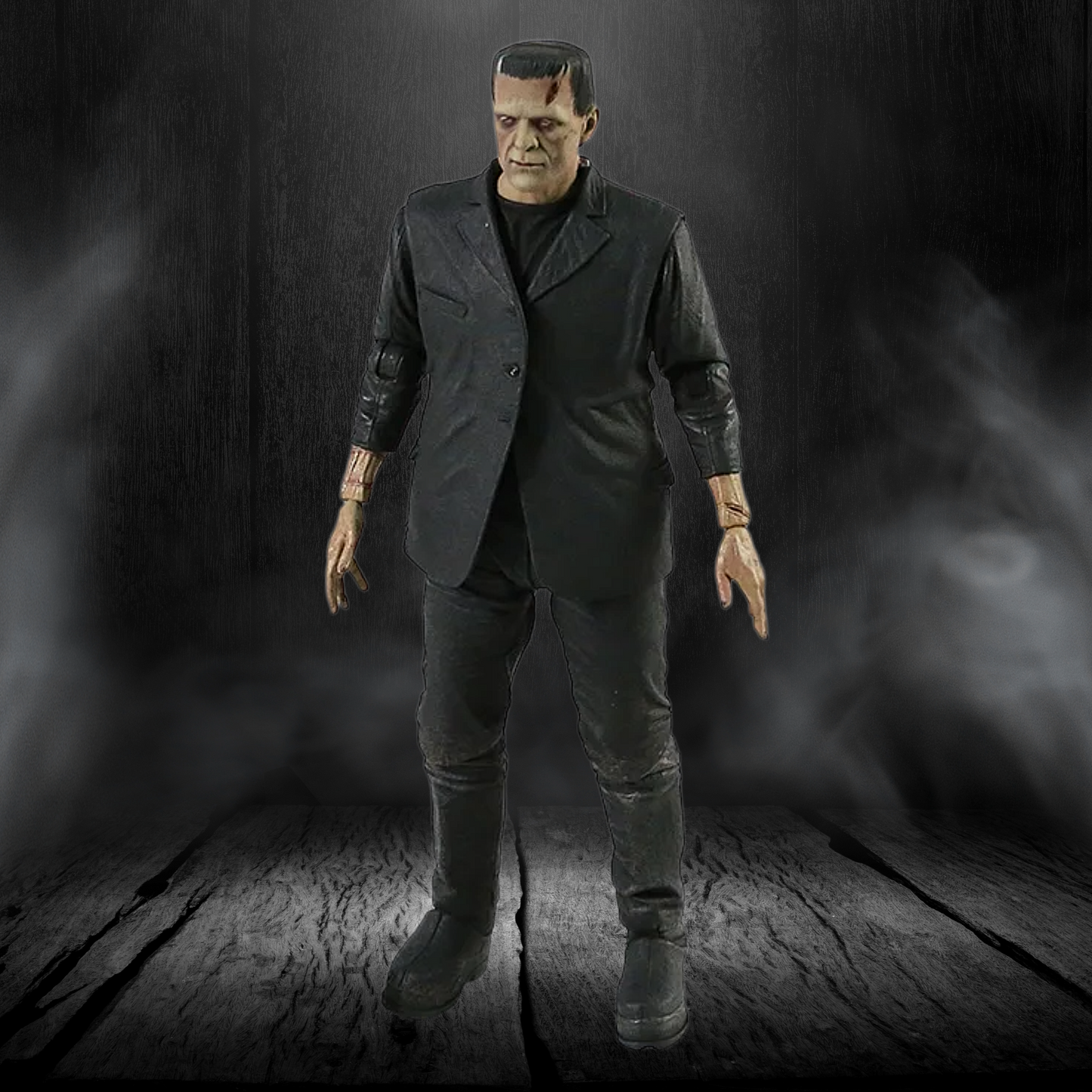 Action figure of a character in a dark suit with a smoky background
