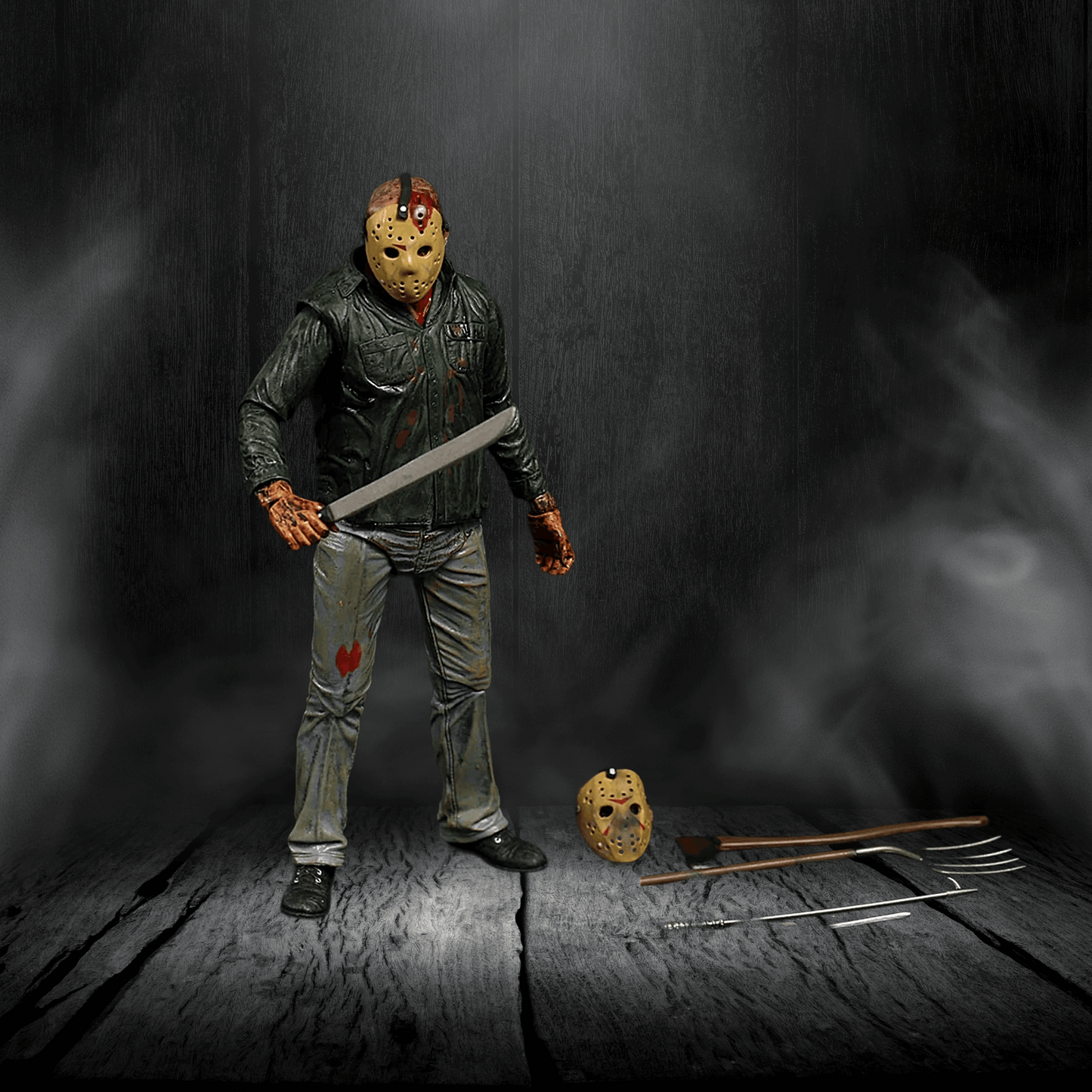 Action figure in a dark setting with a weapon and mask