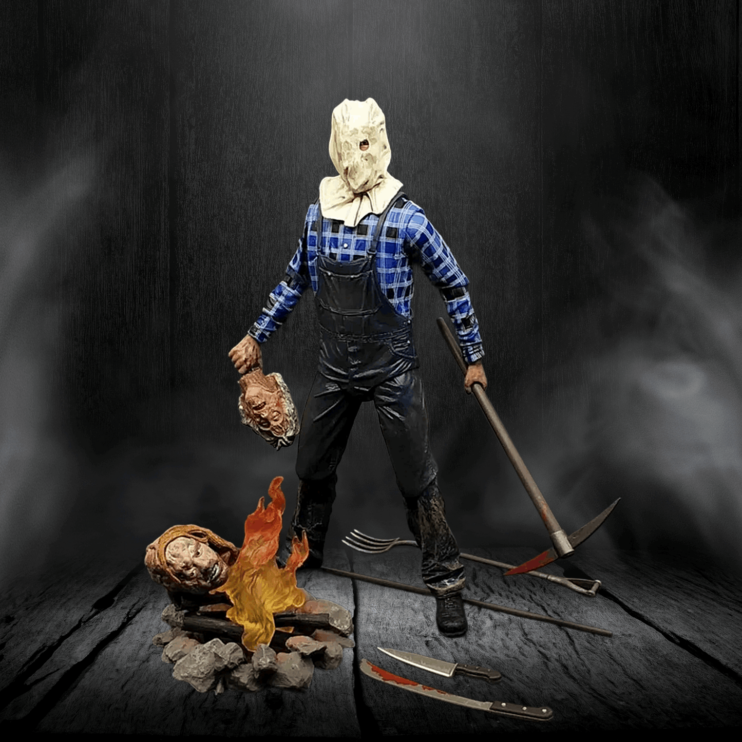 Horror-themed figure with a mask, overalls, and tools on a dark background