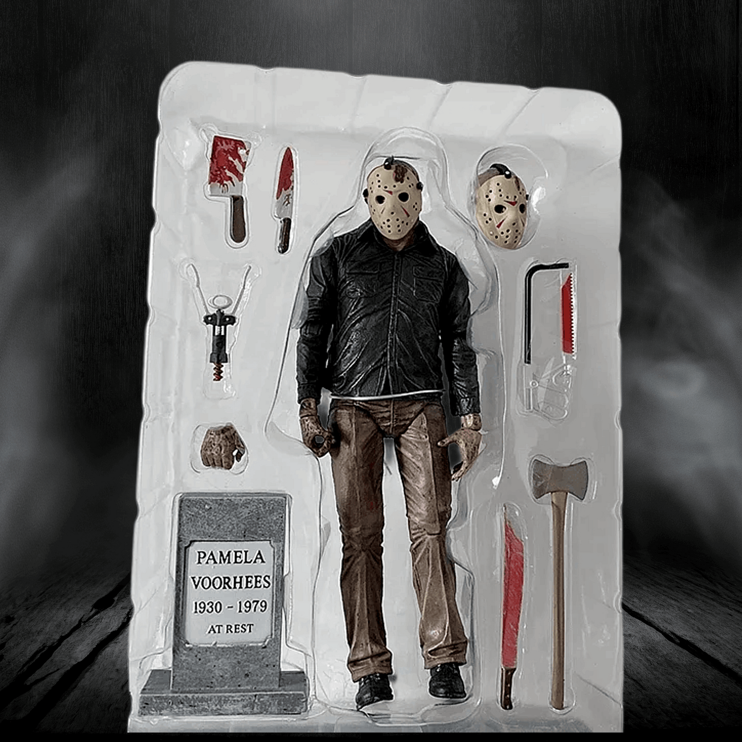 Action figure in a display case with accessories on a dark background