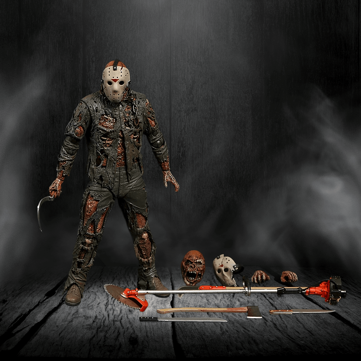 Action figure with a mask and weapons on a dark background