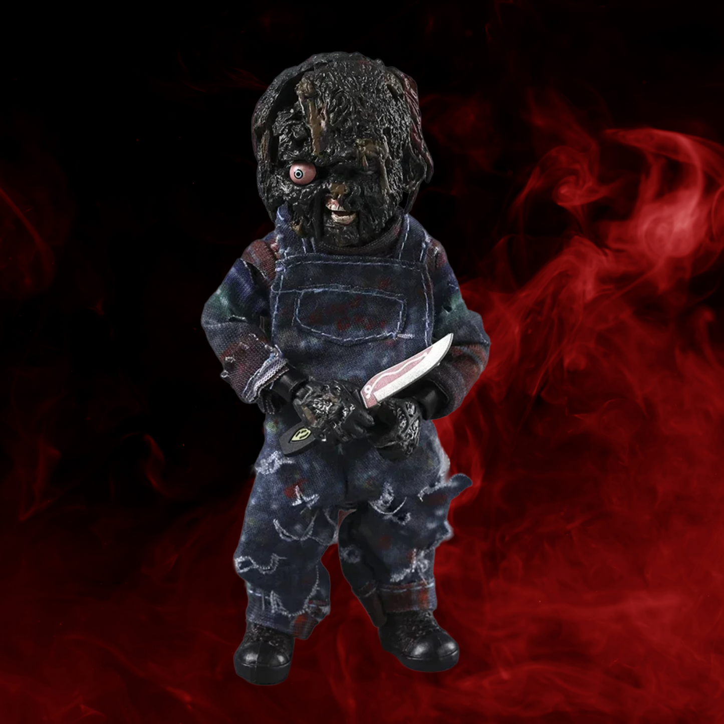Toy figure in a dark costume with a red smoke background