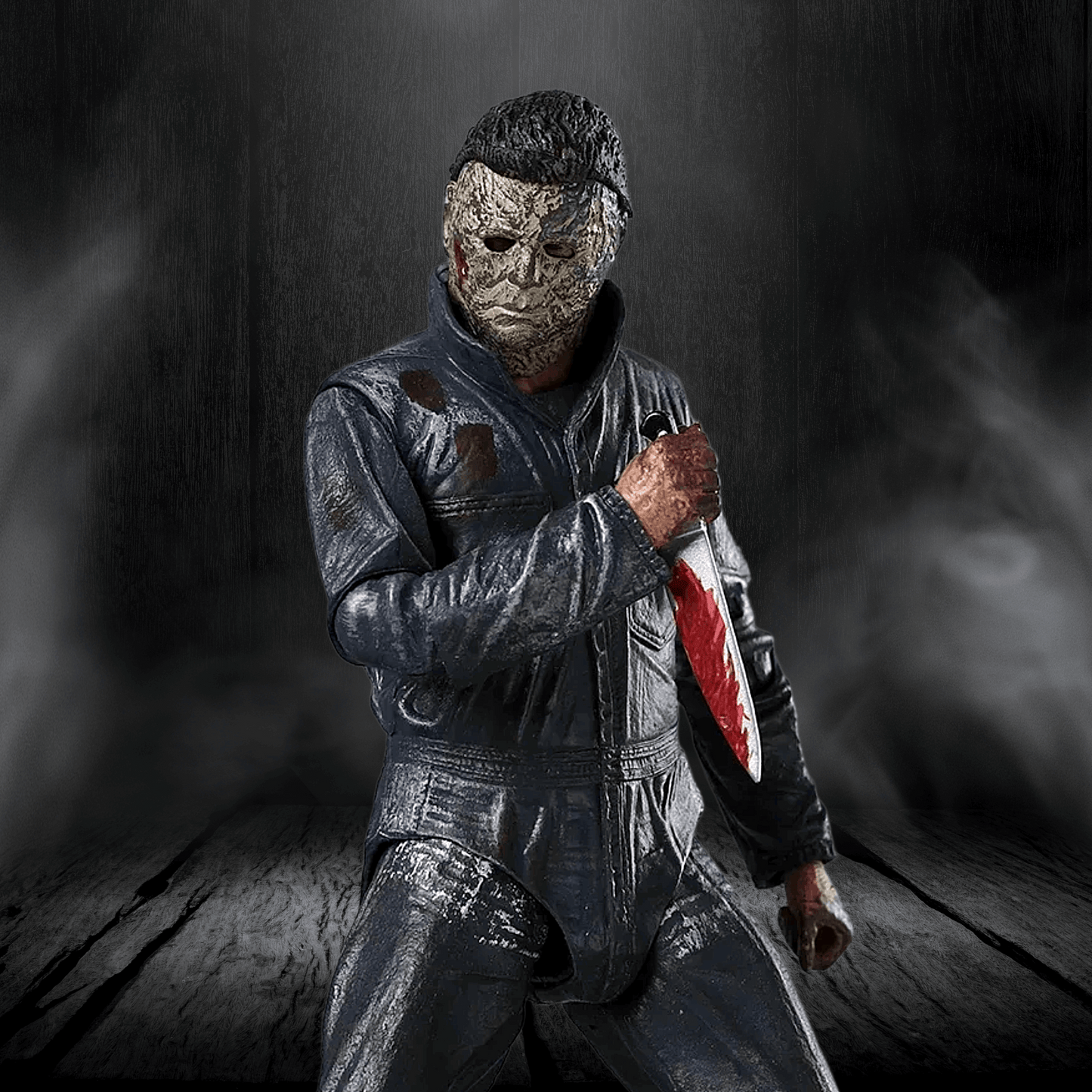 Person in a dark costume with a mask holding a knife on a dark background