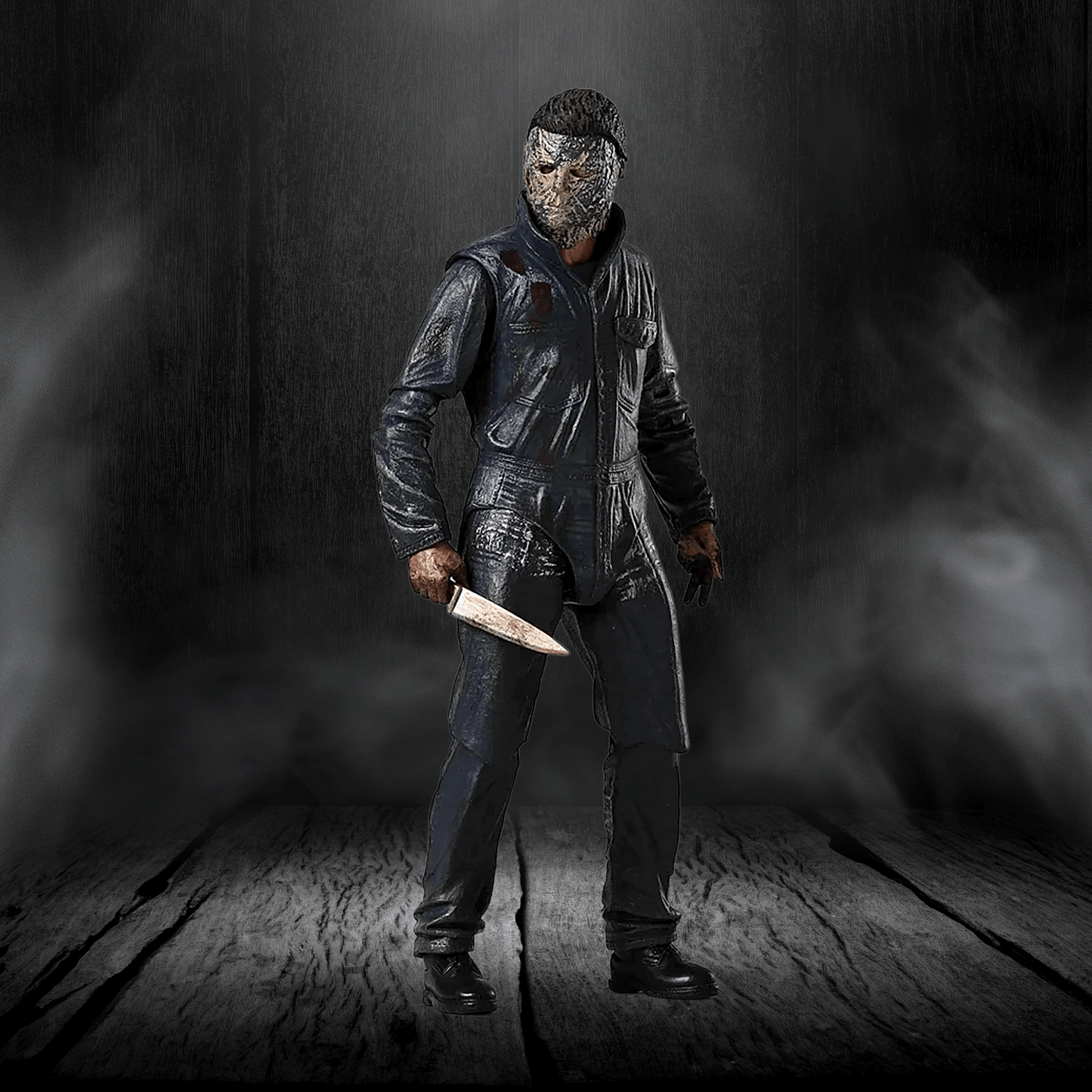Person wearing a dark outfit and mask holding a knife in a dark, smoky setting