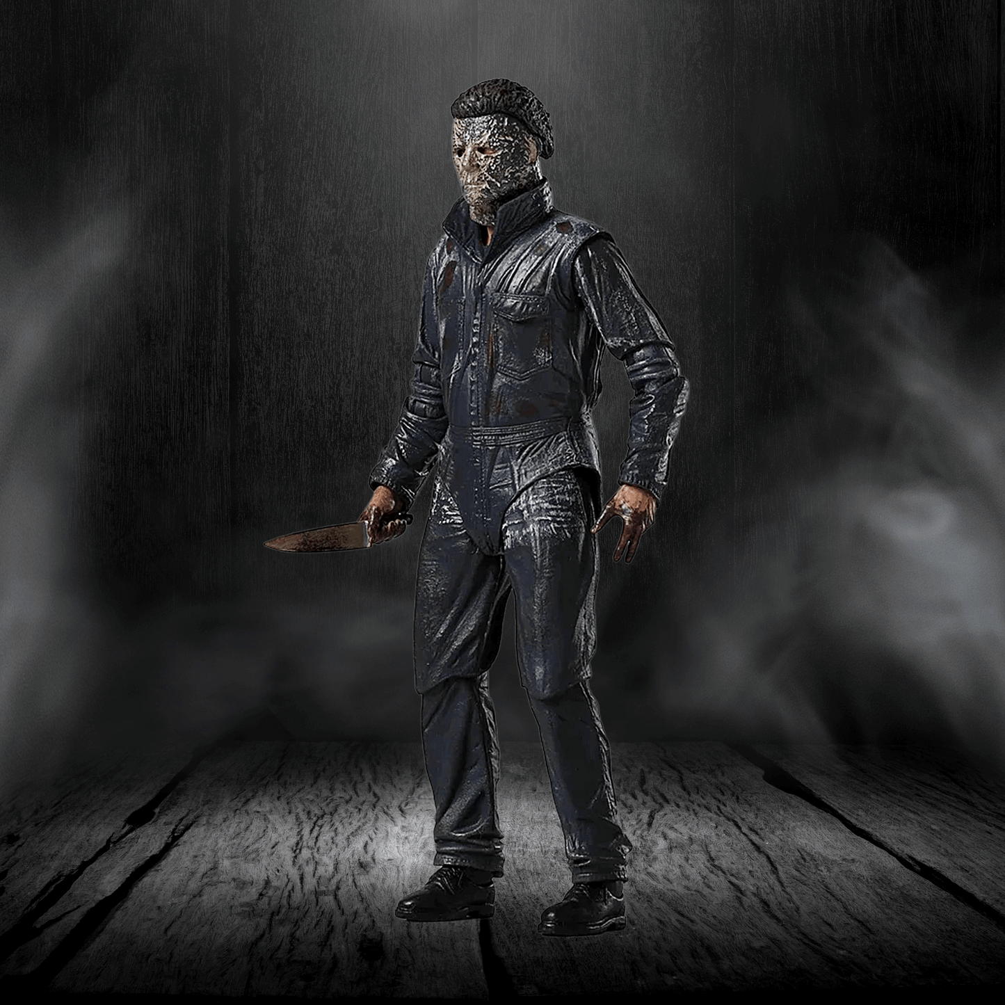 Action figure in a dark, smoky setting holding a knife.