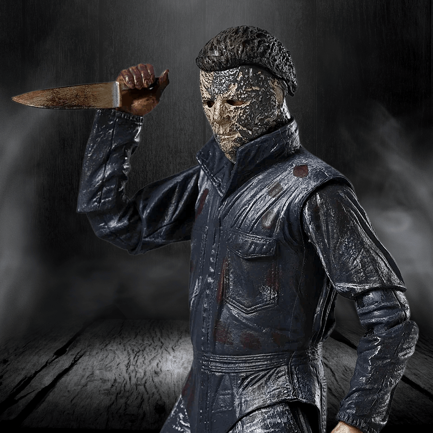 Person in a dark, textured costume holding a knife against a dark background