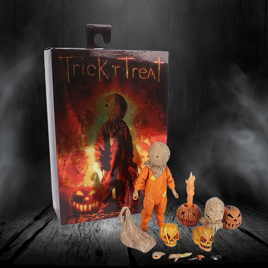 Halloween-themed action figure with packaging and accessories on a dark background