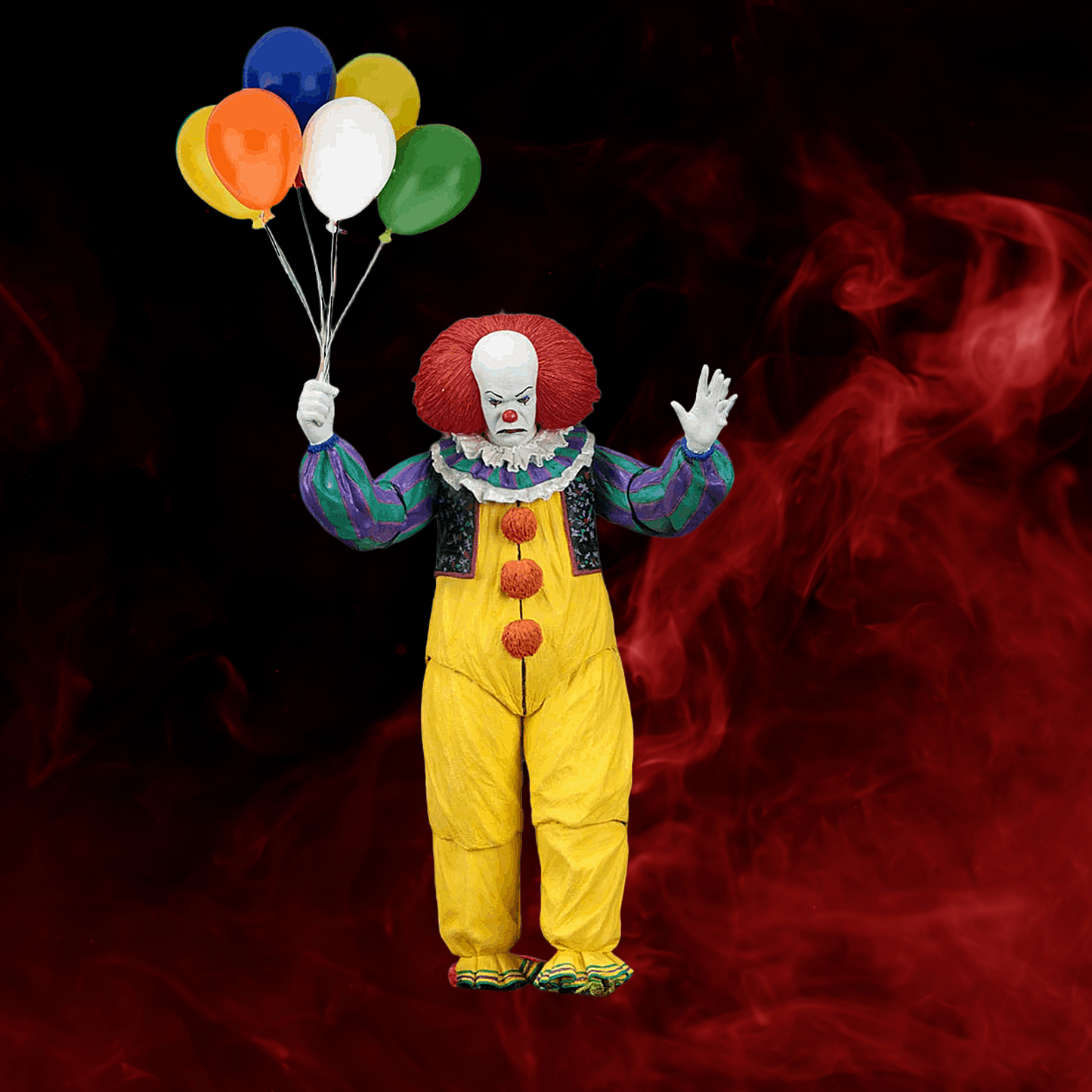 Clown in yellow suit with red hair holding balloons against a dark background