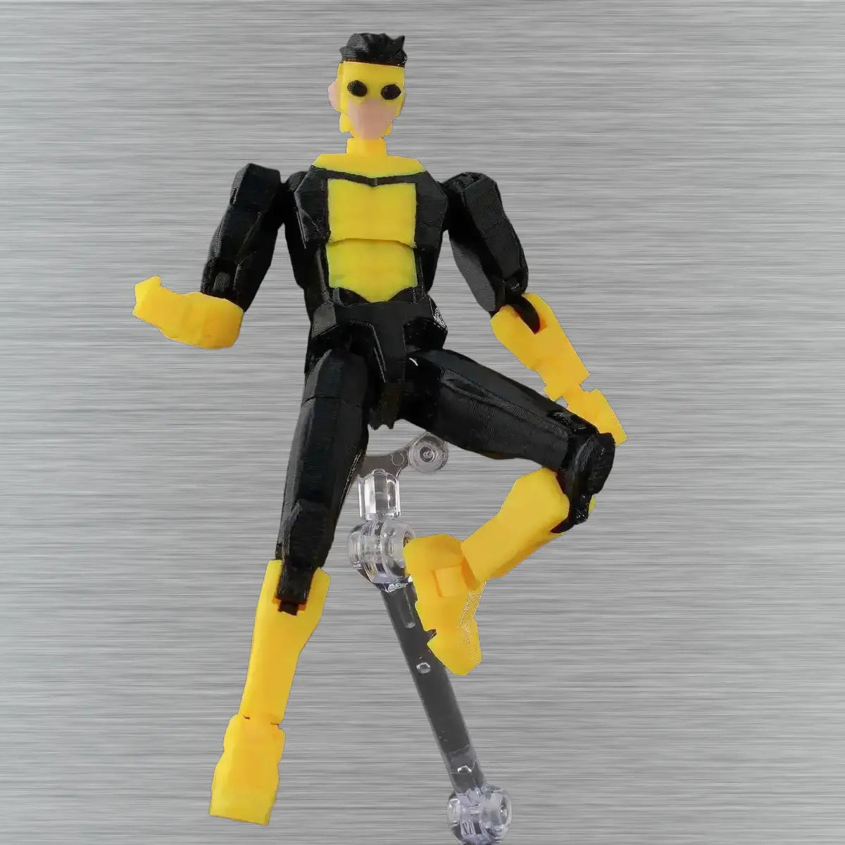 Black and yellow action figure on a textured gray background