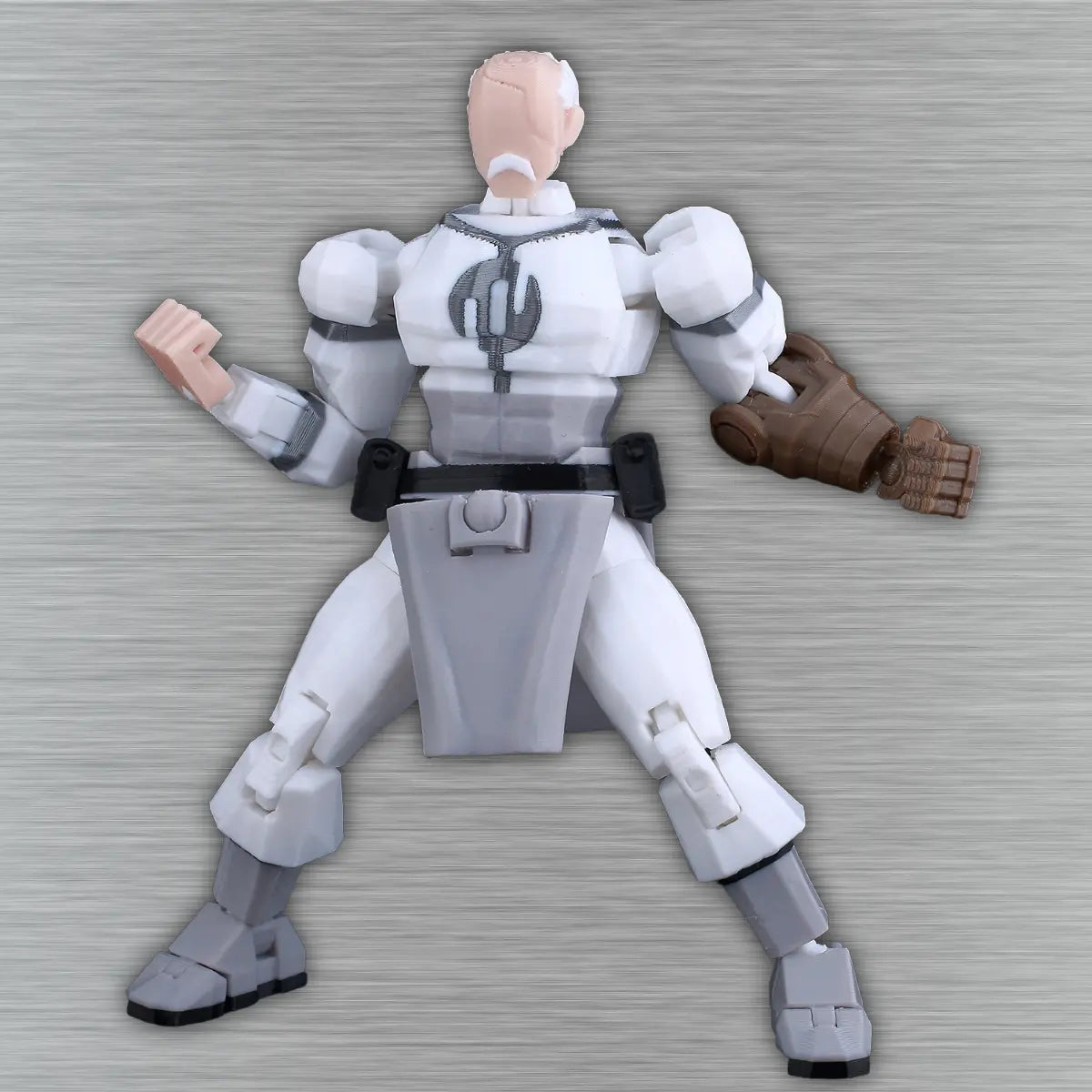Action figure in white and gray suit with brown gloves on a textured gray background