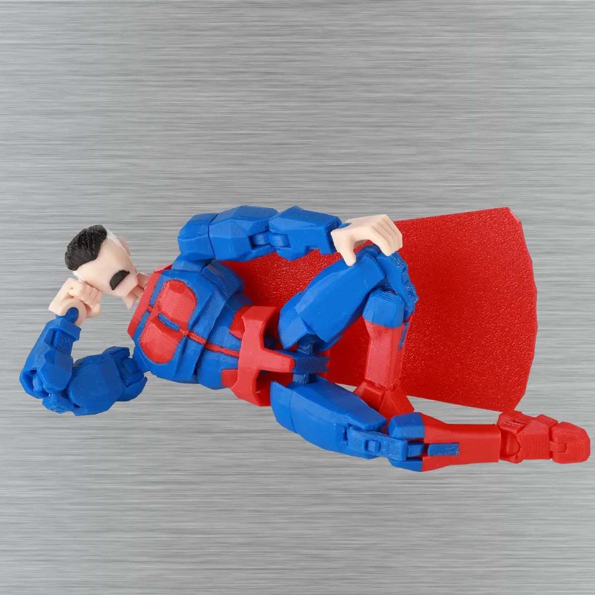 Toy figure with red and blue armor on a textured gray background