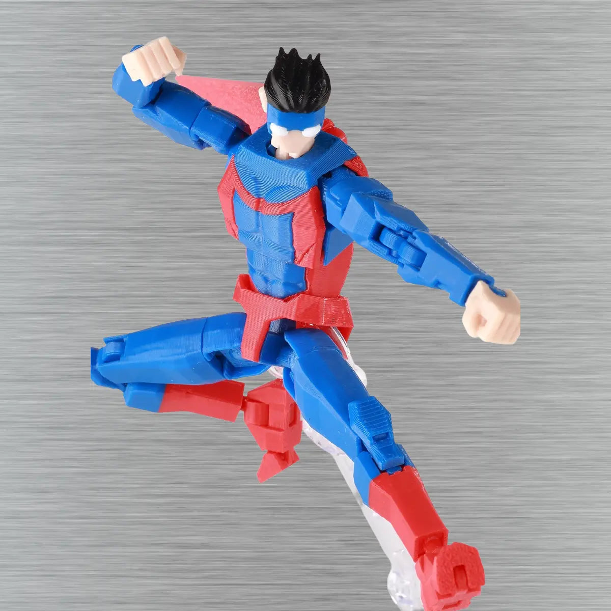 Superhero action figure in blue and red costume on a textured gray background