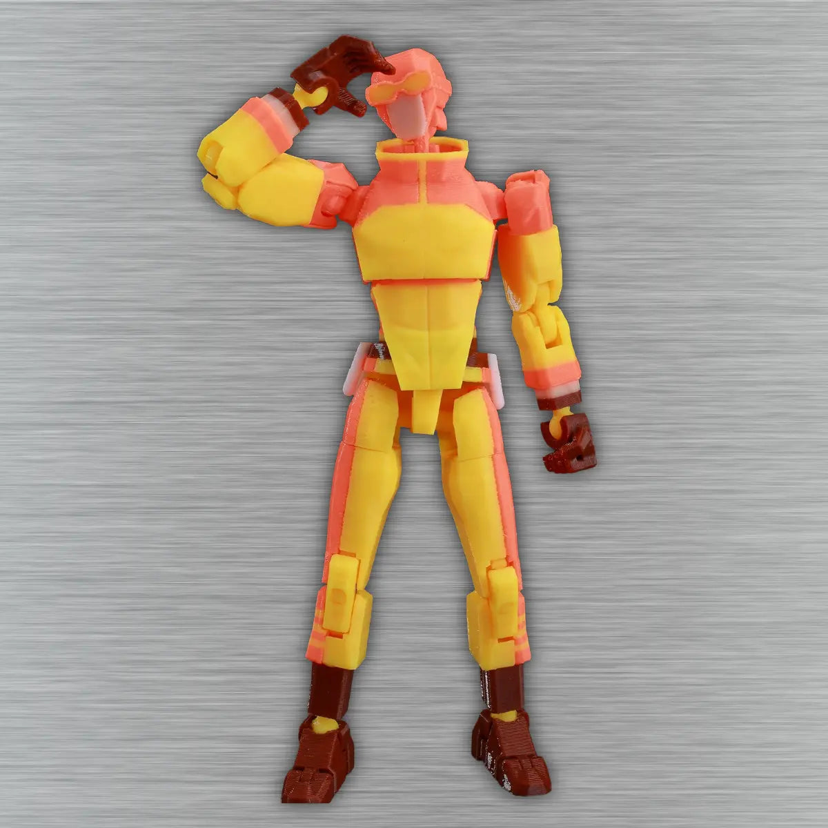 Action figure with yellow and red design on a textured gray background