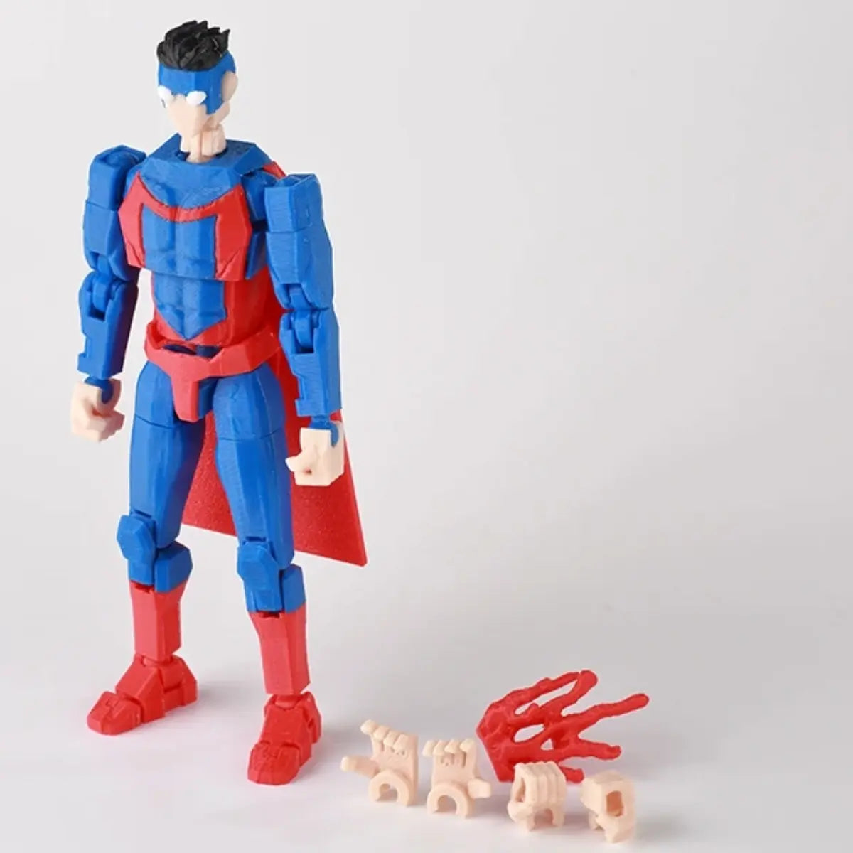 Superhero action figure with interchangeable parts on a light gray background