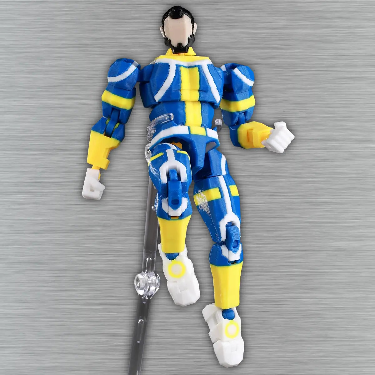 Action figure in blue and yellow costume with a sword on a textured gray background