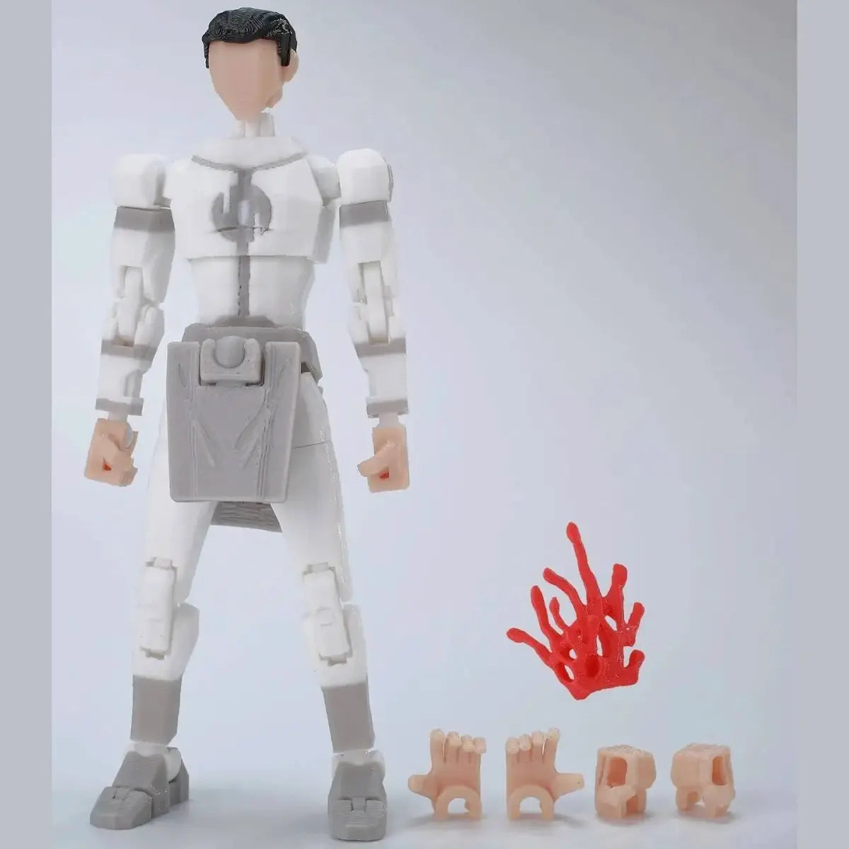 Action figure with additional parts on a plain background