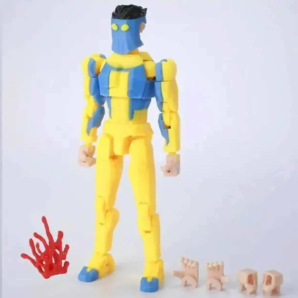 Toy figure with blue and yellow color scheme on a white background