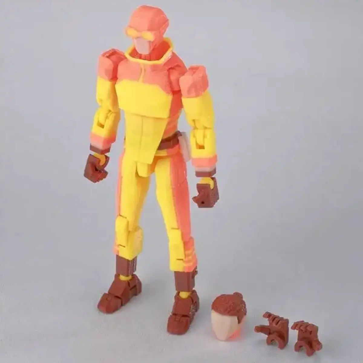 Action figure with a red and yellow suit on a gray background