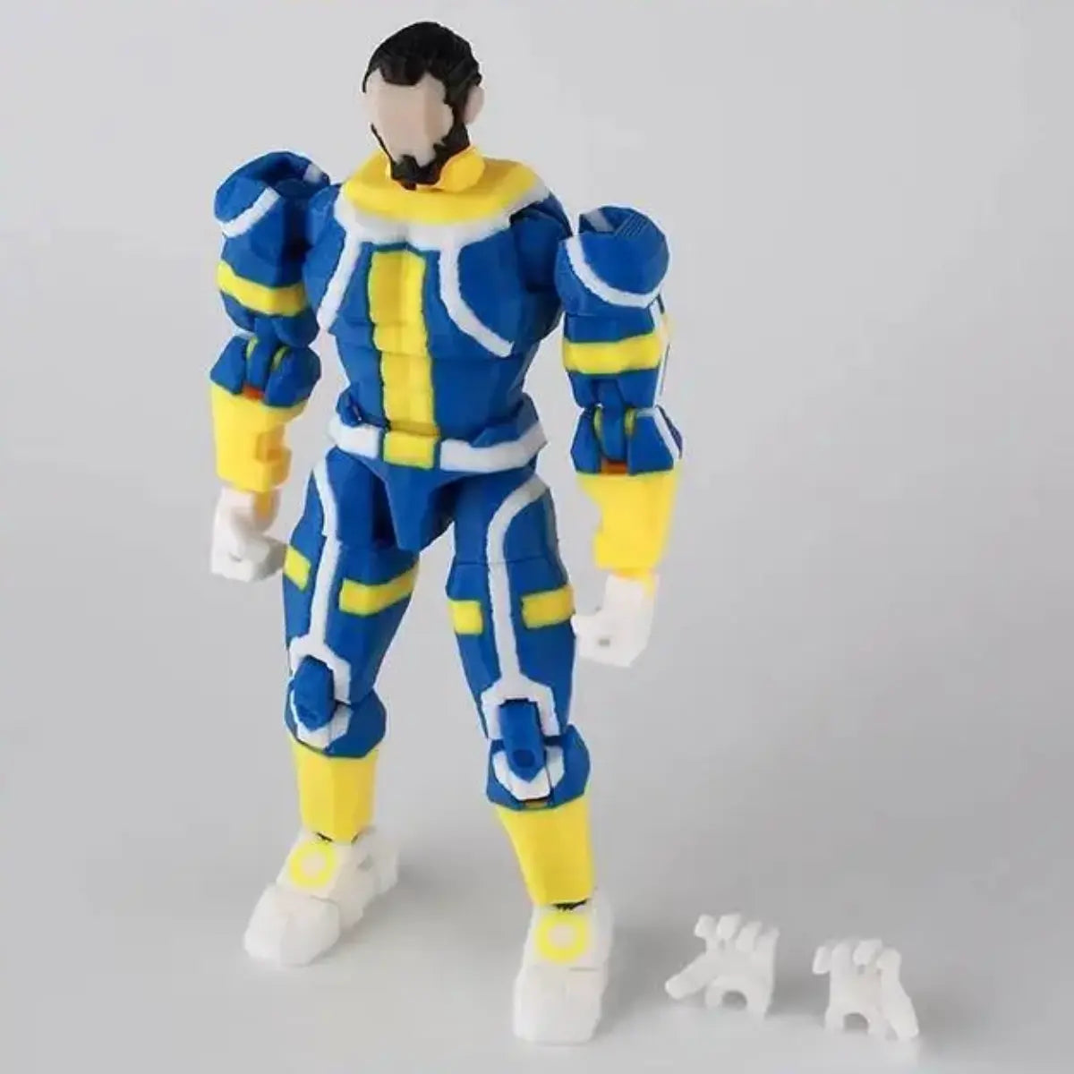 Action figure in blue and yellow outfit on a gray background