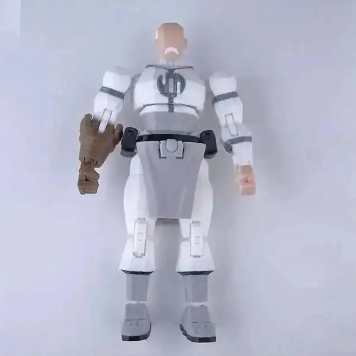 Action figure with a white and gray suit on a plain background