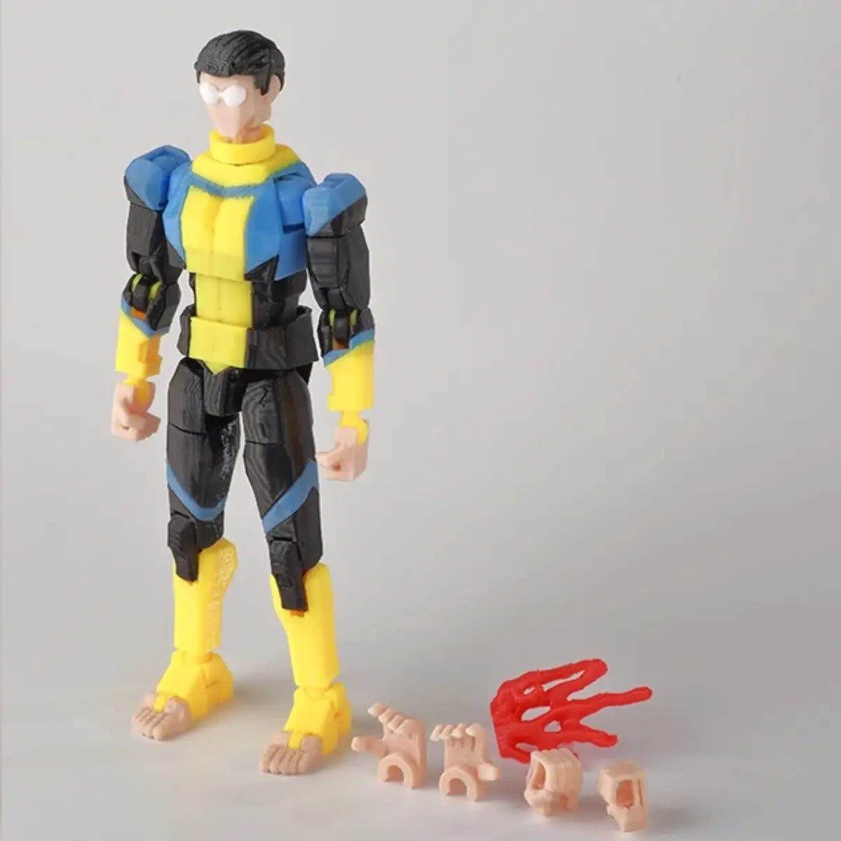 Action figure with interchangeable parts on a gray background