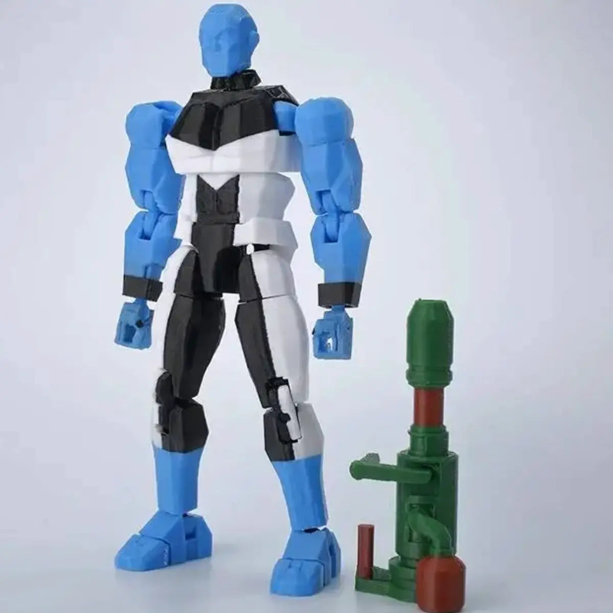 Toy robot figure with blue, black, and gray color scheme on a white background