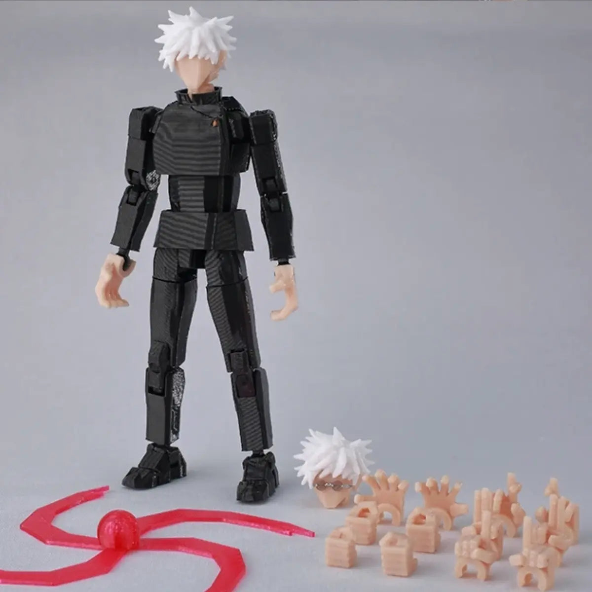 Action figure with white hair and black outfit on a gray background