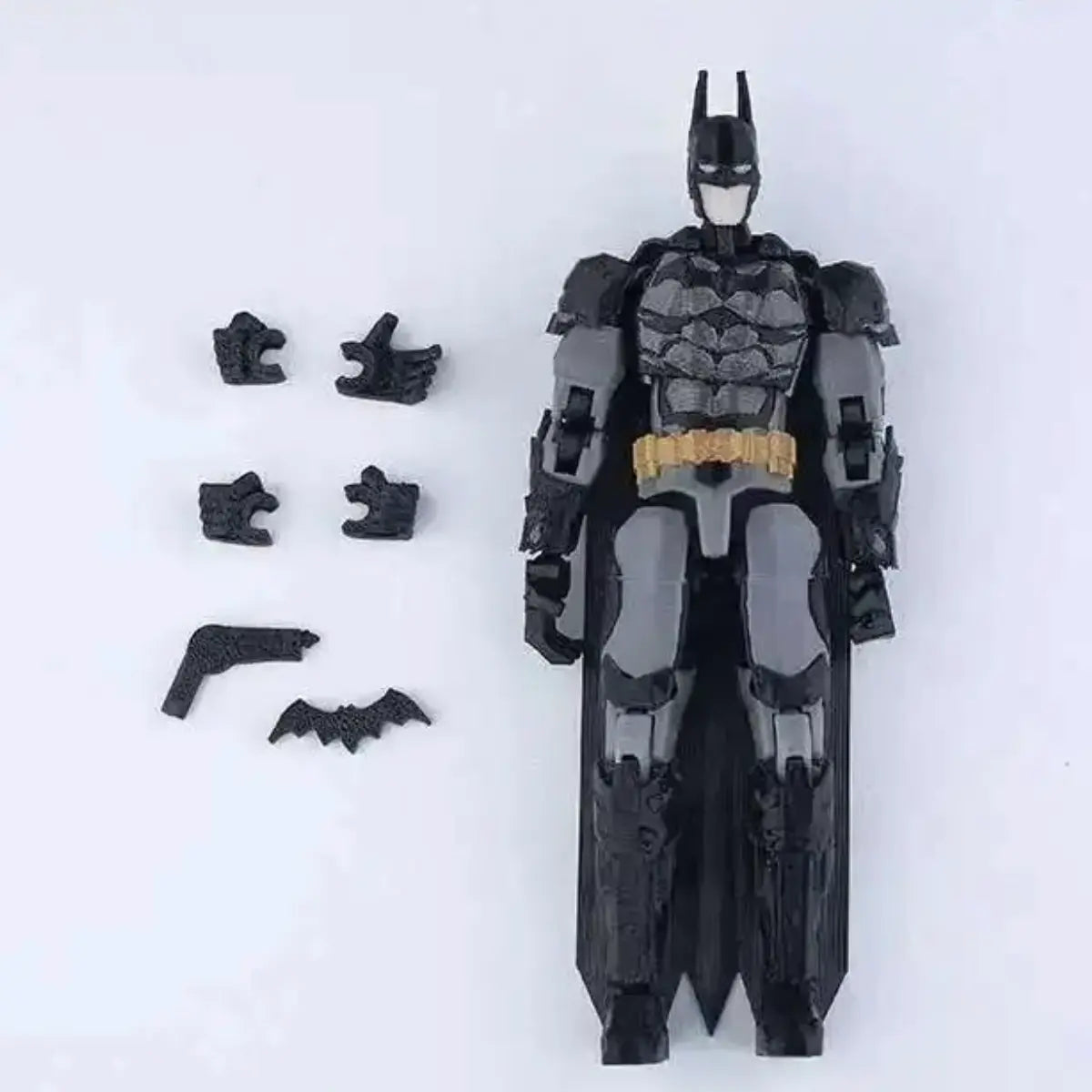 Batman action figure with additional parts on a white background