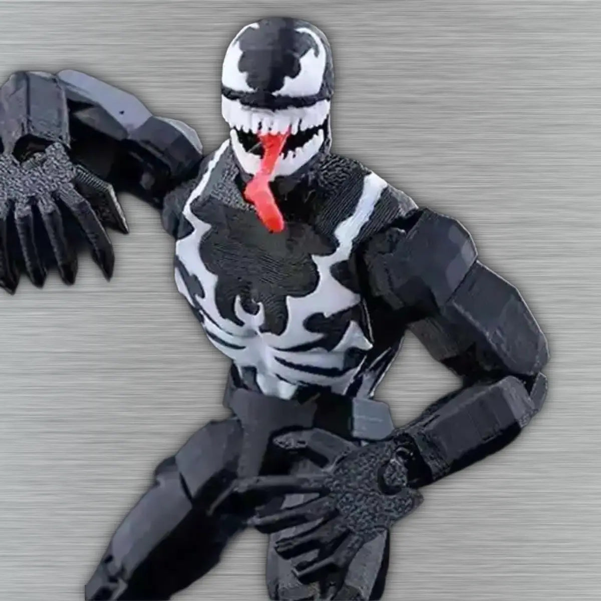 Venom action figure on a textured gray background