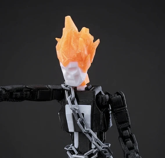 Toy figure with a flaming head on a textured gray background