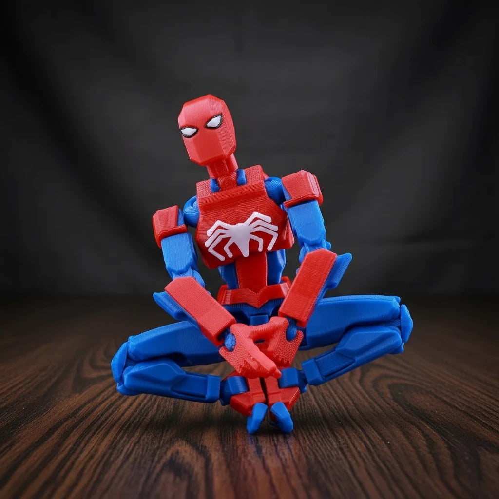 Red and blue superhero figurine with spider emblem on a metallic surface
