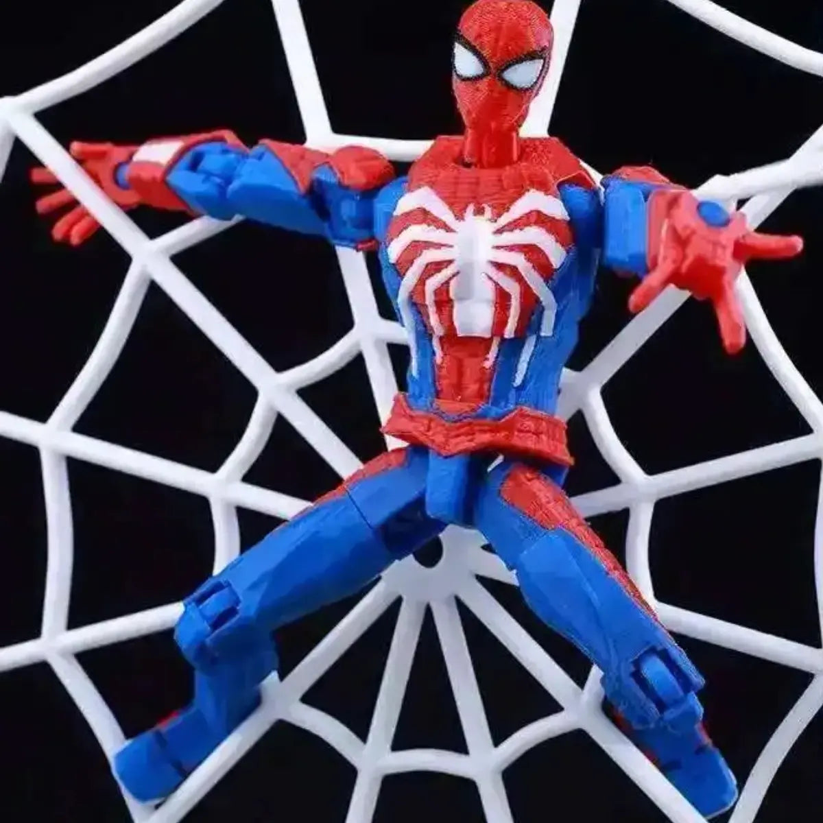 Spider-Man action figure on a web background