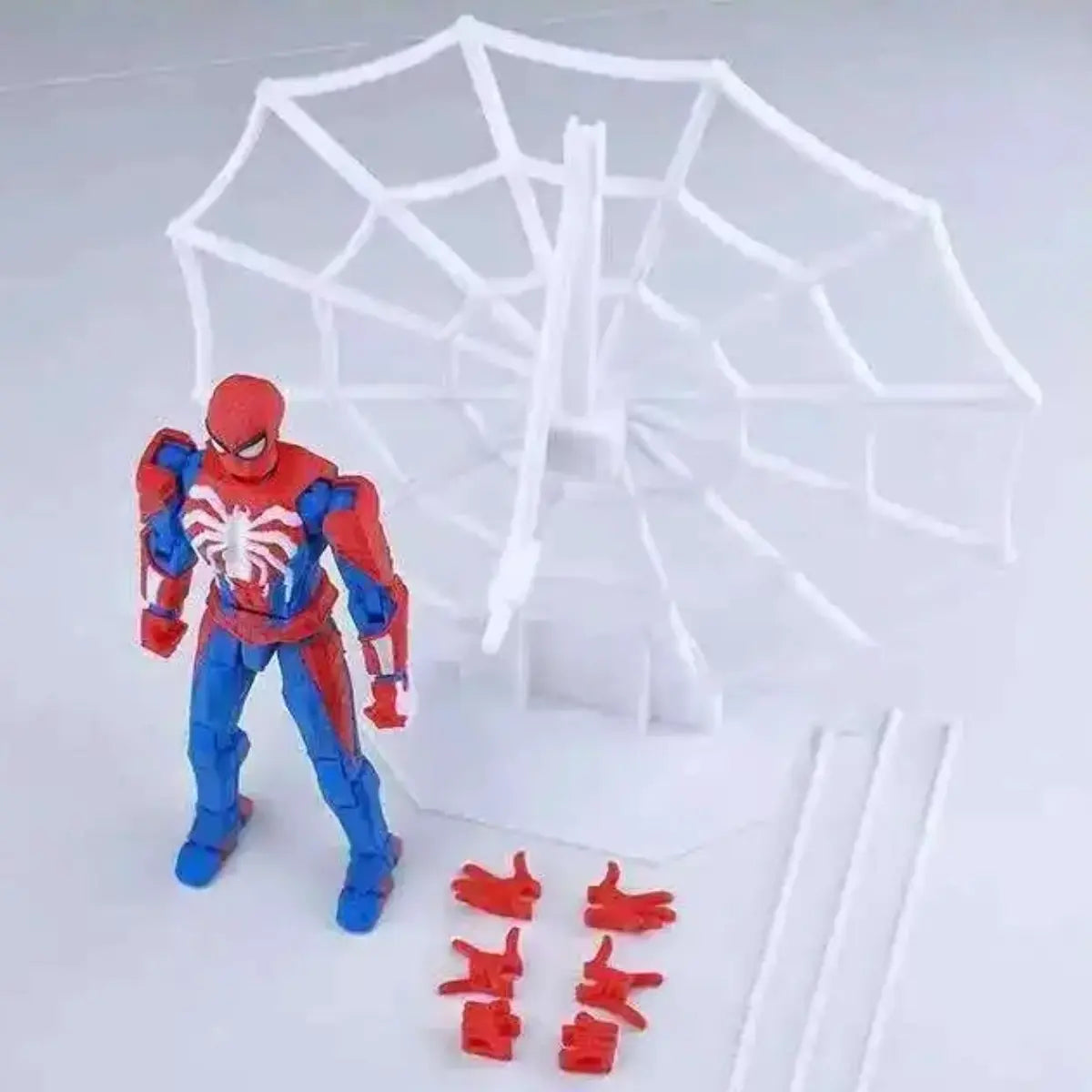 Spider-Man action figure with a web on a light gray background