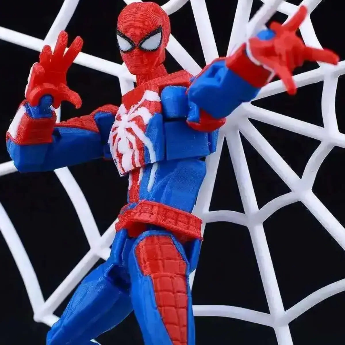 Spider-Man action figure in front of a spider web background