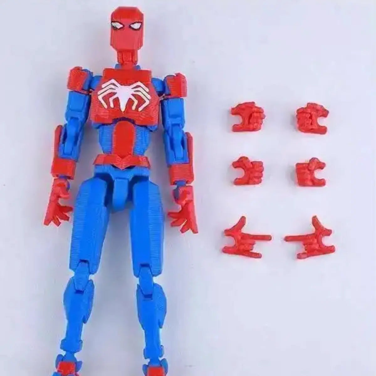 Toy figure of a superhero in red and blue with Chinese characters on a white background