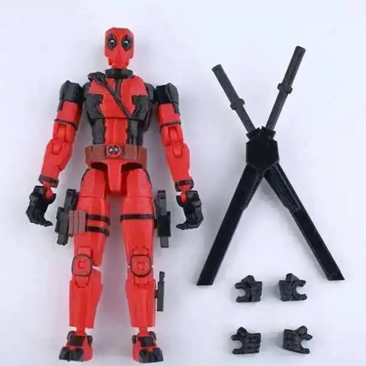 Action figure of a superhero in red and black with accessories on a white background