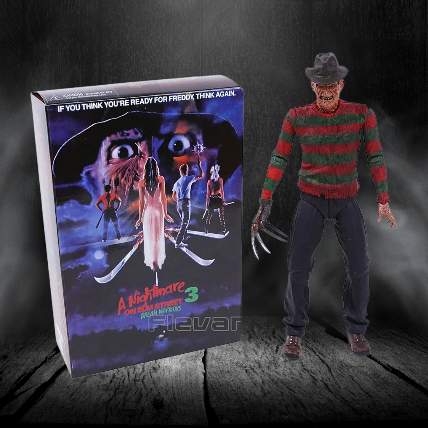 Action figure of Freddy Krueger from 'A Nightmare on Elm Street 3' next to its box on a dark background