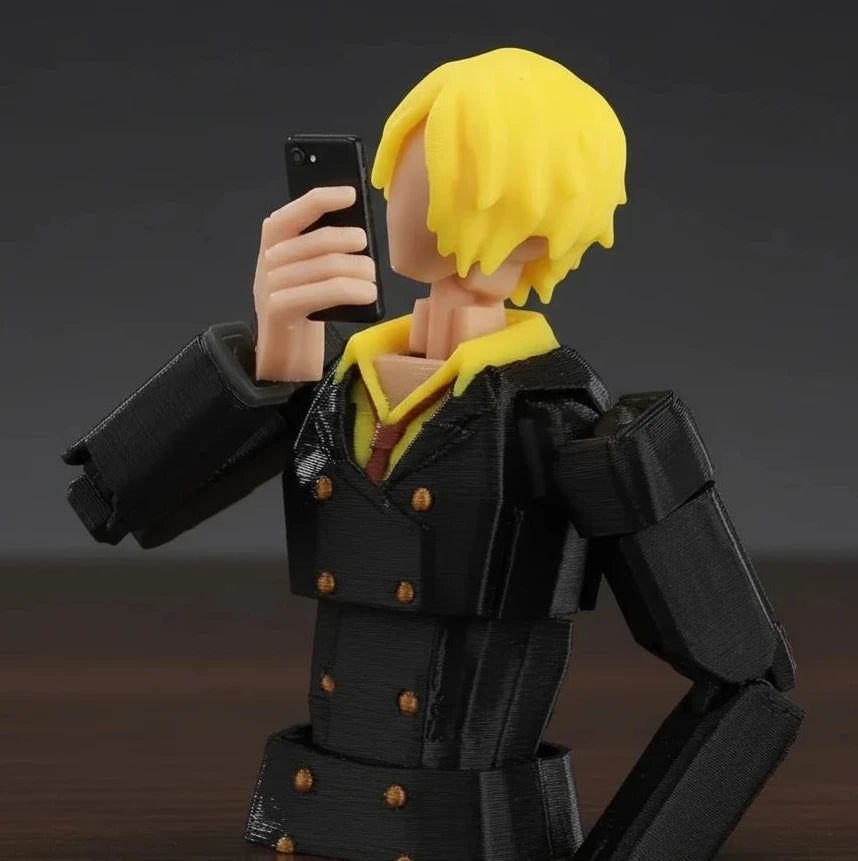 Action figure with yellow hair and black coat against a textured gray background