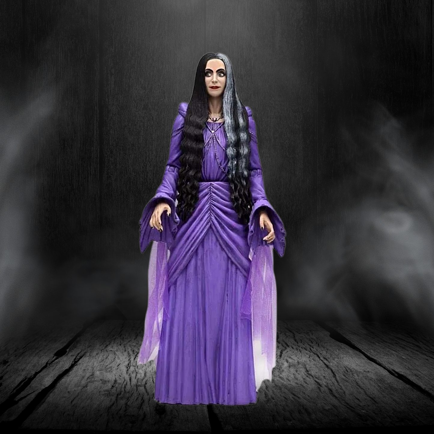 Action figure in a purple dress with long black hair against a dark background