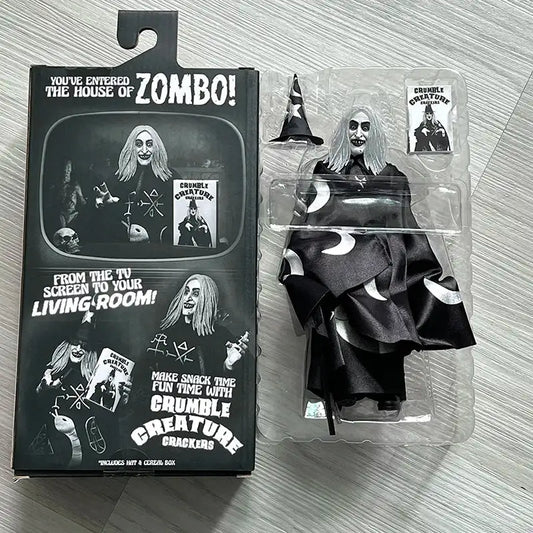 Toy figure in packaging with 'House of Zombo' branding on a textured surface