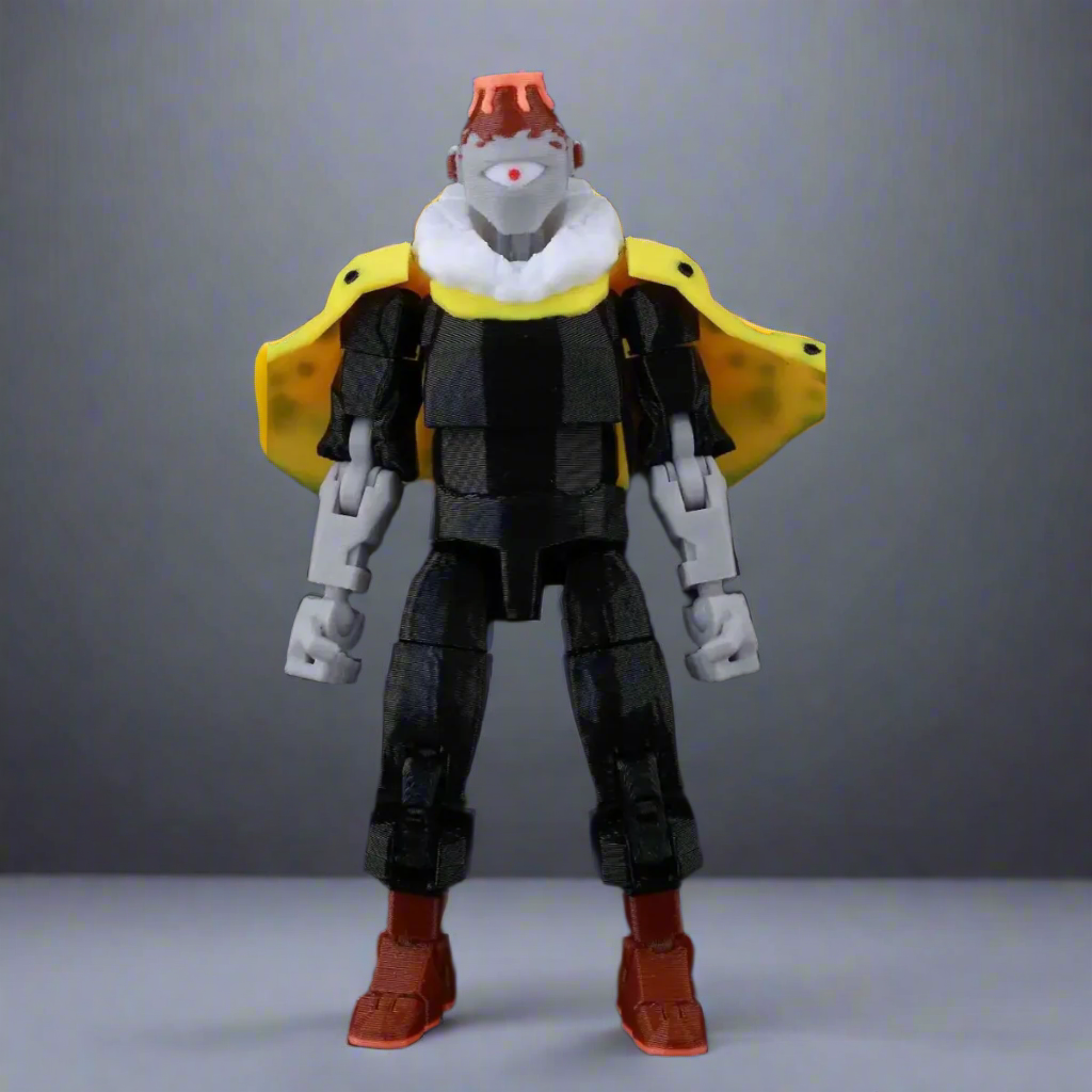 Toy figure with a black and gray outfit, yellow cape, and red shoes on a dark background