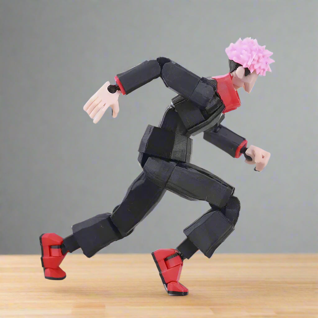Action figure with pink hair and black and red outfit on a white background