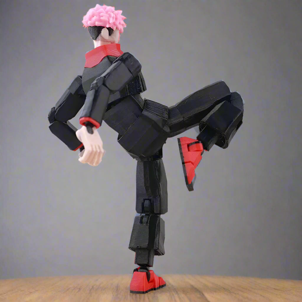 Black and red robot toy figure on a light gray background