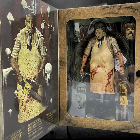 Action figure in a box with a bloody apron and weapon, surrounded by other action figures.