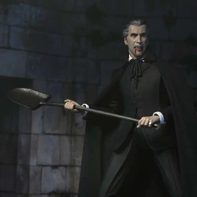 Vampire figurine holding a spoon against a stone wall background