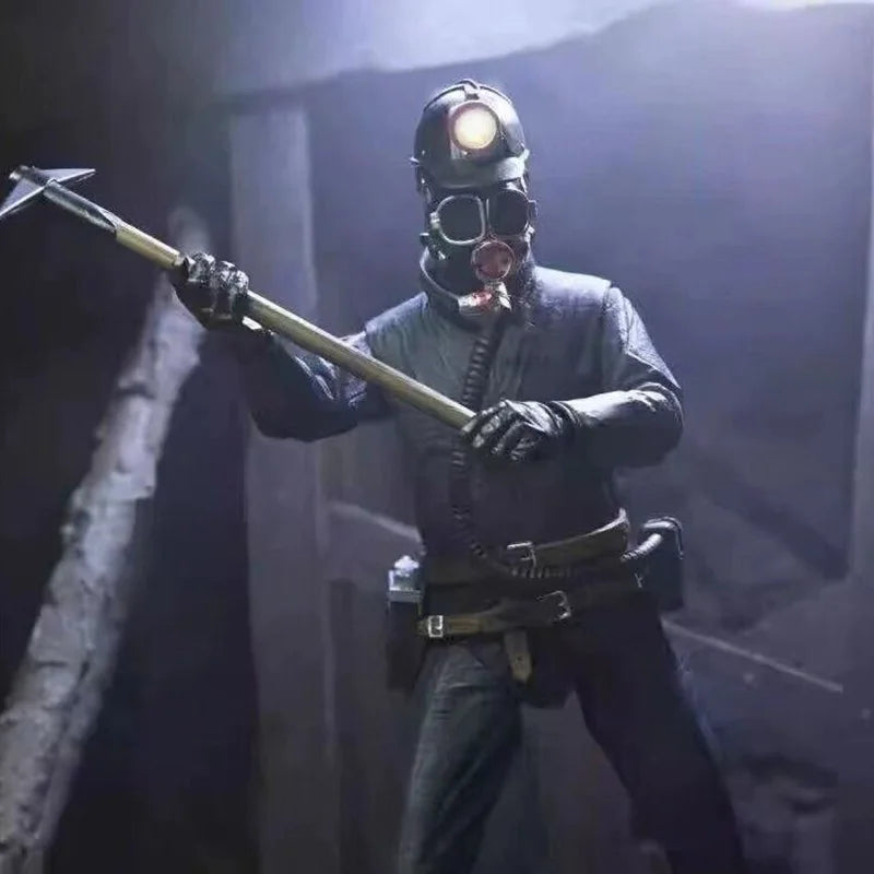 Person in a dark, industrial setting wearing a helmet and holding a tool.