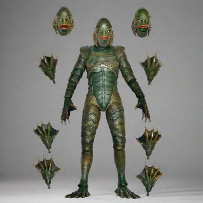 Green alien action figure with interchangeable heads and limbs on a white background